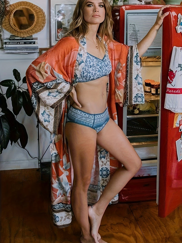 Damskie kimono z wzorem w czerwone kwiaty. Lekka i modna narzutka na lato.