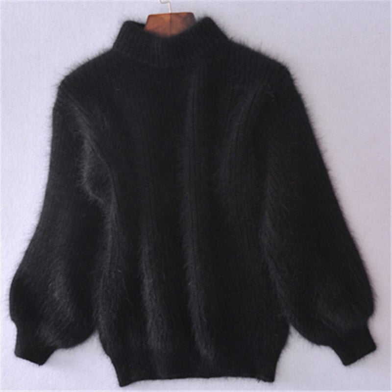 Elegancki, a zarazem komfortowy sweter damski z dzianiny. Luźny splot, modny na zimowe dni.