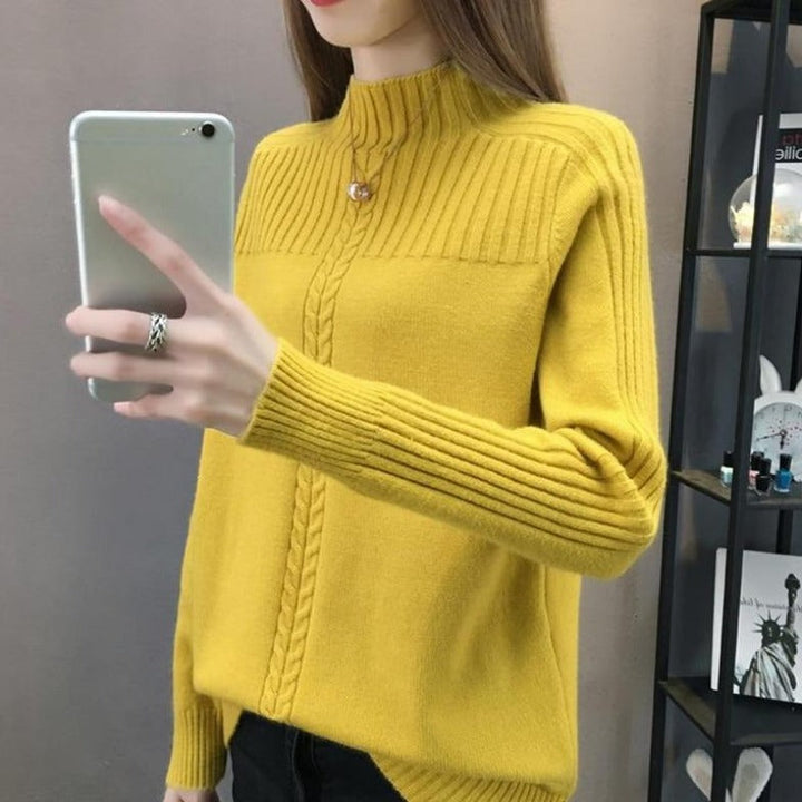 Kobiecy sweter z golfem z grubej dzianiny, z ozdobnym splotem, idealny na zimowe dni i eleganckie stylizacje.