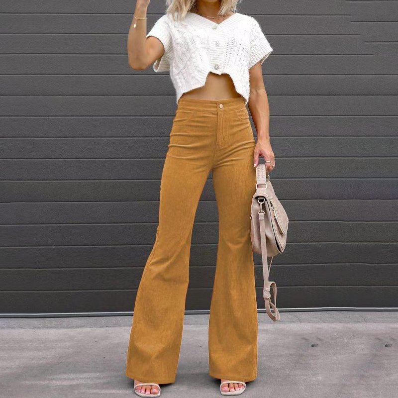 Eleganckie jesienne spodnie damskie culottes z wysokim stanem. Szerokie nogawki, modny styl retro.