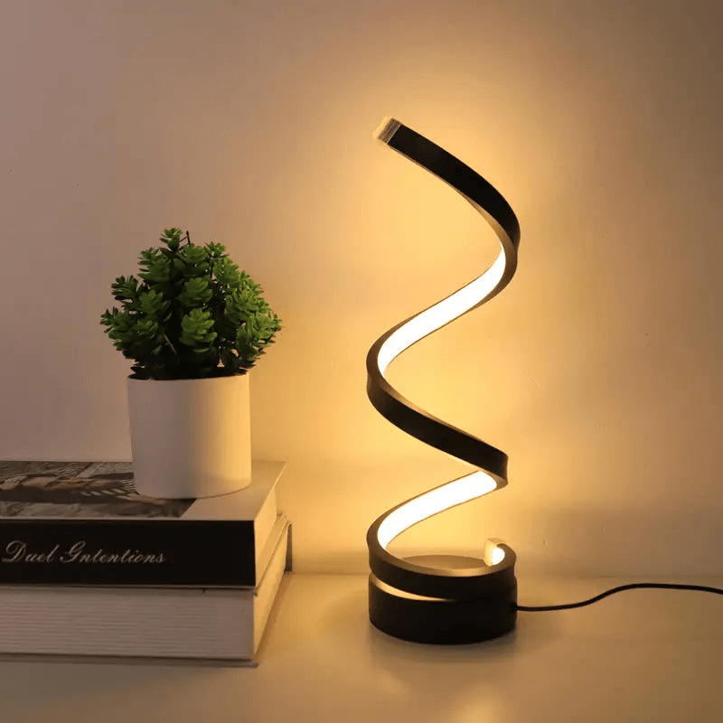 Nowoczesna lampka stołowa LED o spiralnym kształcie, energooszczędna. Designerskie oświetlenie wnętrz.