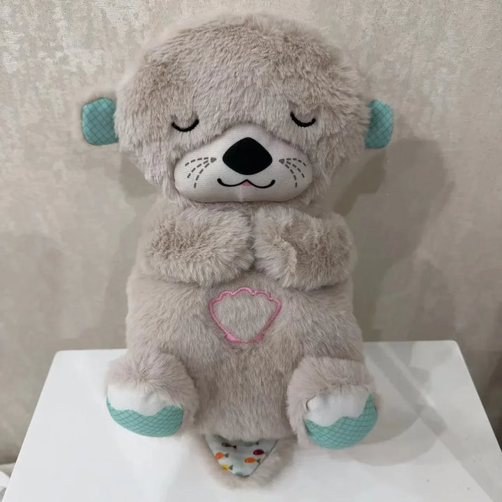 Uspokajający pluszak muzyczny koala z lampką nocną. Idealny dla niemowląt, wspiera spokojny sen dziecka.