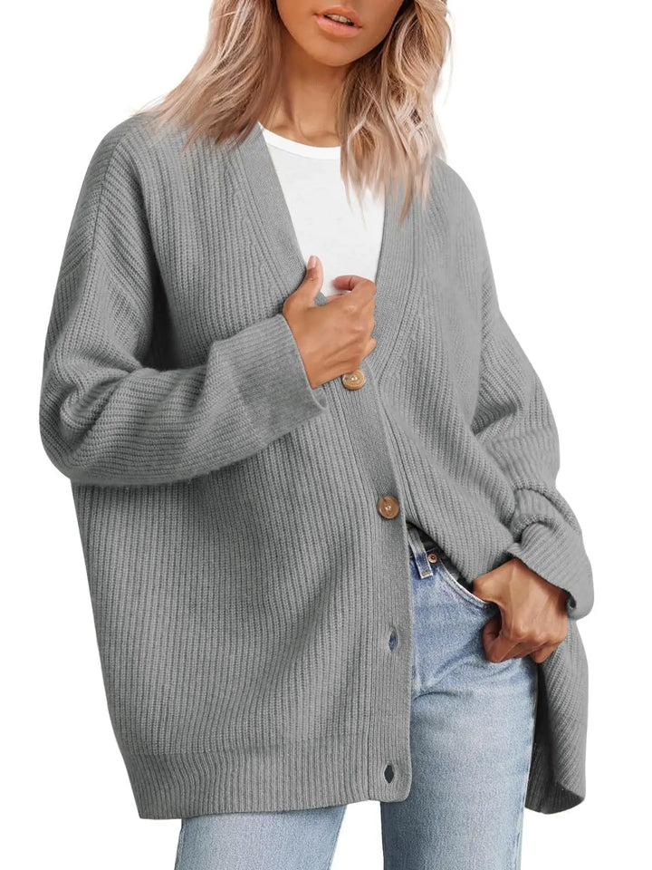 Elegancki sweter damski, dekolt V. Luźny fason, na jesień i zimę. Modny i wygodny kardigan.