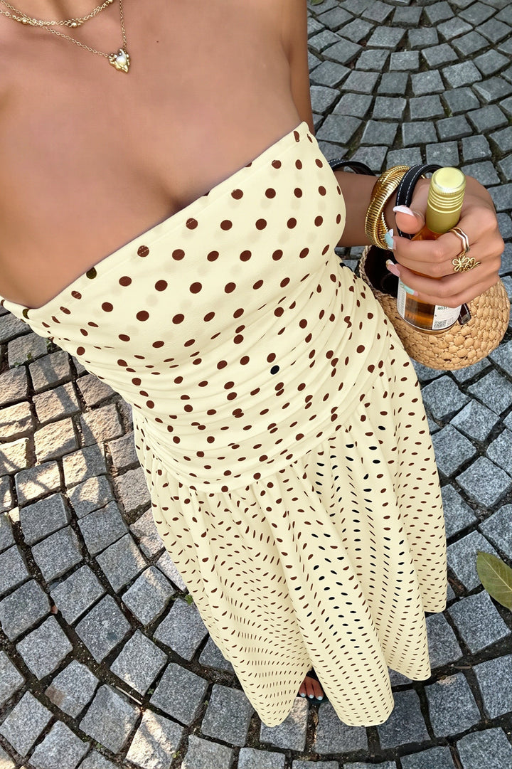 Elegancka sukienka maxi damska w białe kropki, fason bez ramiączek, idealna na imprezę.