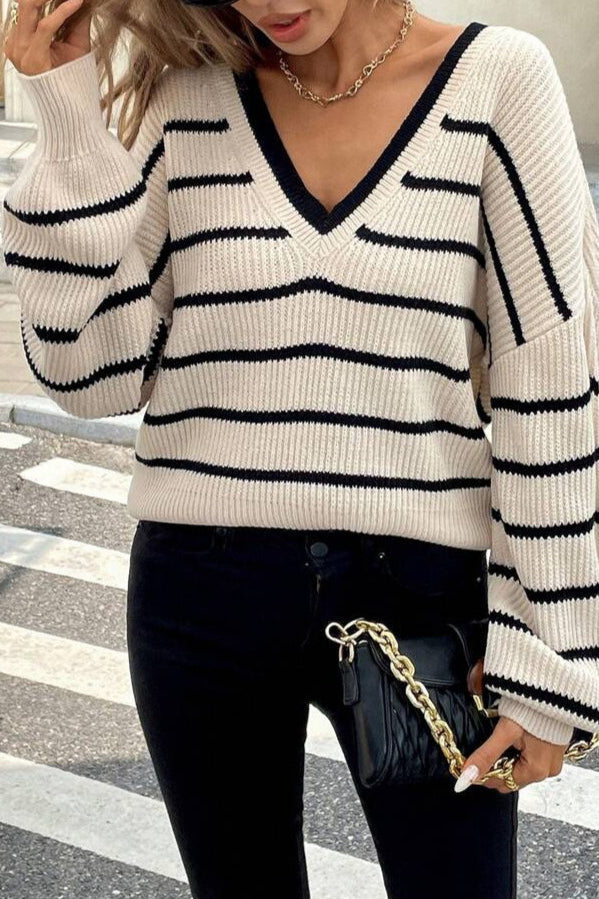 Casualowy sweter damski w paski z długim rękawem, dekoltem V i elegancką kokardą.