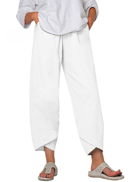 Luźne spodnie damskie z kieszeniami, elastyczny pas, casualowe, eleganckie i wygodne.