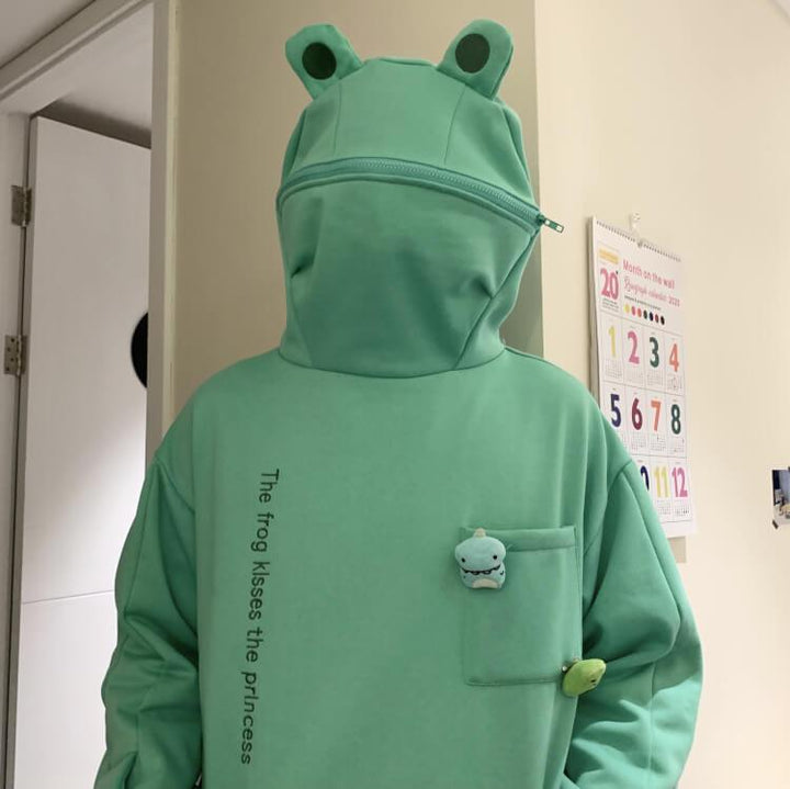 Sweter z kapturem unisex z zabawną żabą. Modny, oversizowy design, idealny do casualowych stylizacji.