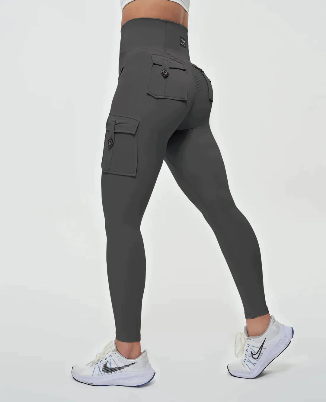 Wygodne damskie legginsy cargo z wysokim stanem, elastyczny materiał modelujący sylwetkę, idealne do aktywności.
