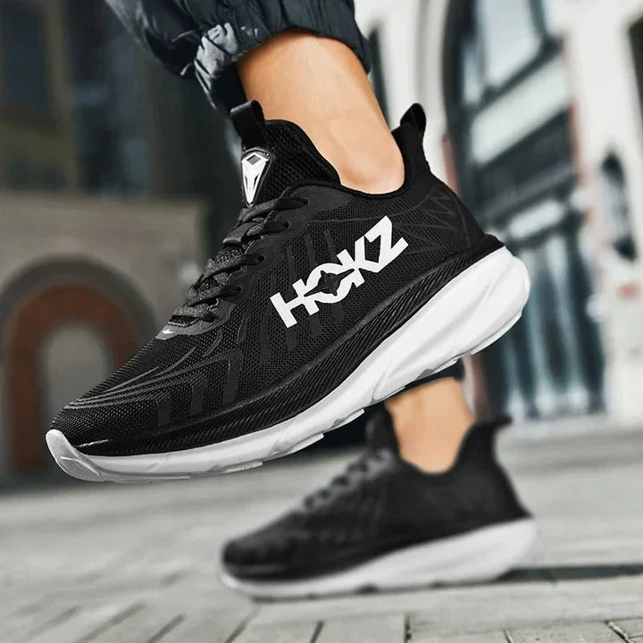 Wygodne obuwie unisex do biegania, treningu i aktywności fitness.