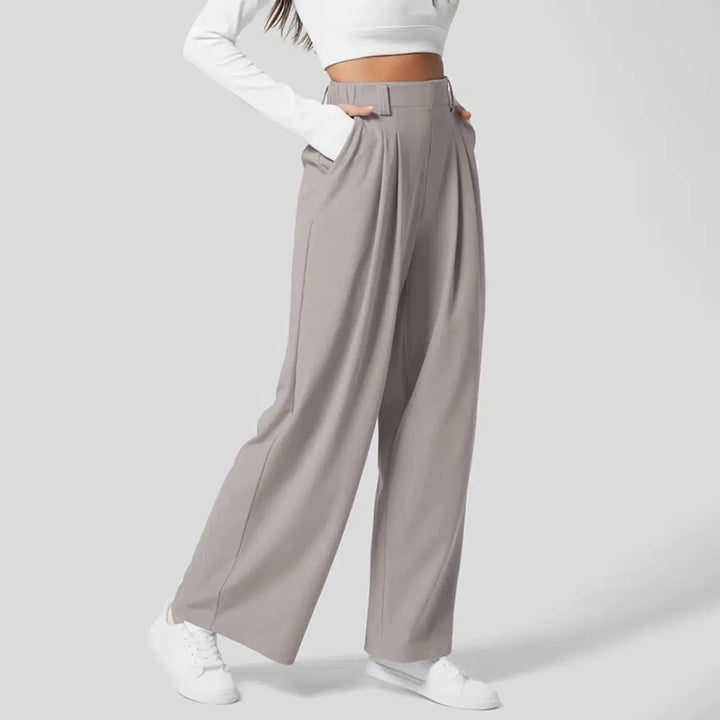Stylowe spodnie damskie z szerokimi nogawkami, wysoki stan. Idealne do biura i casual.