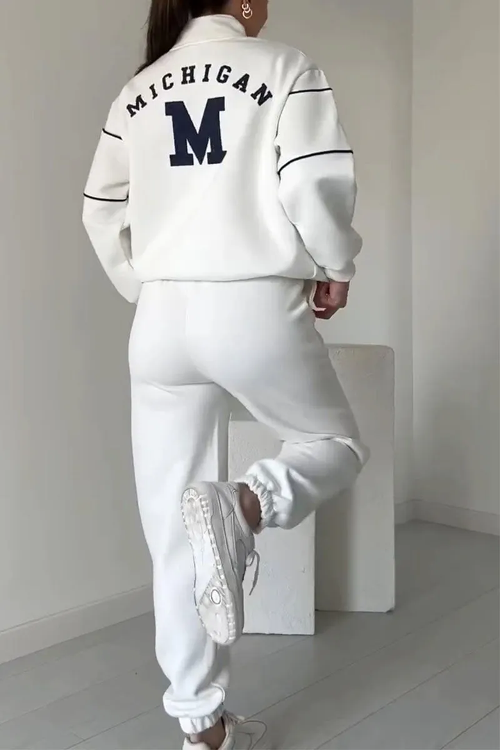 Komplet damski: dres sportowy z kontrastowymi paskami, luźny fason, idealny loungewear na relaks.