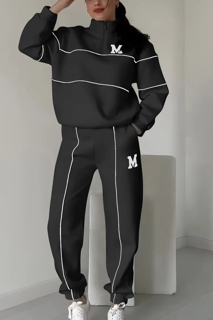 Damski dres streetwear z modnym luźnym krojem i eleganckimi kontrastowymi liniami.