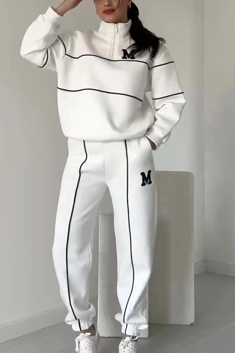 Modny dres damski streetwear z luźnym krojem i stylowymi liniami, wygodny komplet na każdą okazję.