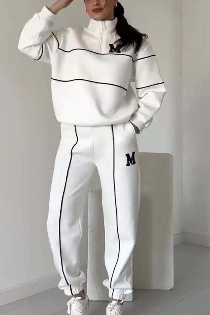 Modny dres damski streetwear z luźnym krojem i stylowymi liniami, wygodny komplet na każdą okazję.