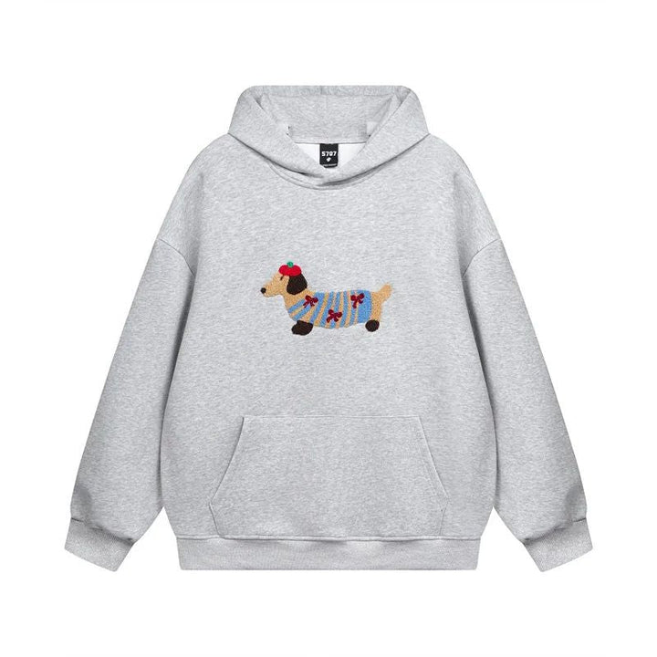 Unisex bluza oversize z detalem haftowanego jamnika. Miękki i modny sweter dla komfortowego stylu na co dzień.