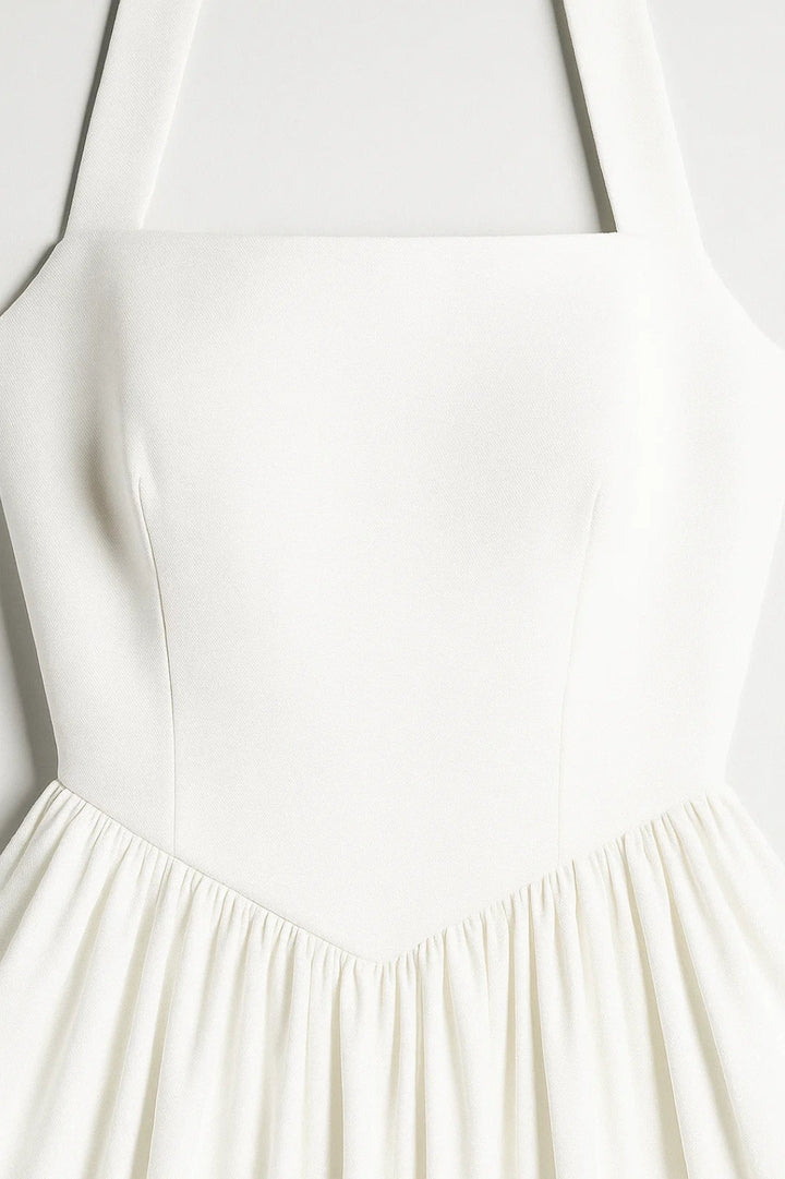 Wyjątkowa damska sukienka midi na wesele. Krój A-line z dekoltem halter podkreśla elegancję i styl.