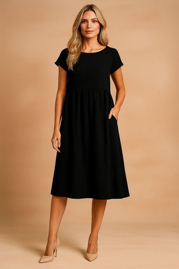Modna damska sukienka casual midi, zwiewna i komfortowa. Perfekcyjny wybór na letnie wyjścia.