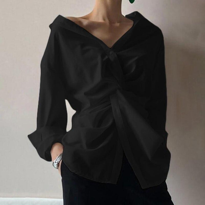 Modna koszula damska z eleganckim marszczeniem i guzikami, idealna do casualowych stylizacji.