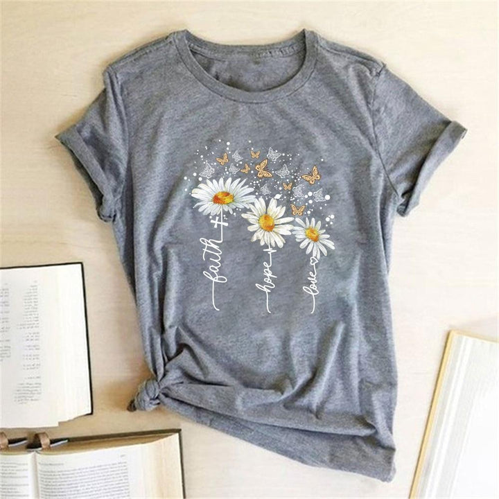 Stylowa letnia koszulka damska T-shirt z kwiatowym motywem, świetna do casualowych stylizacji.