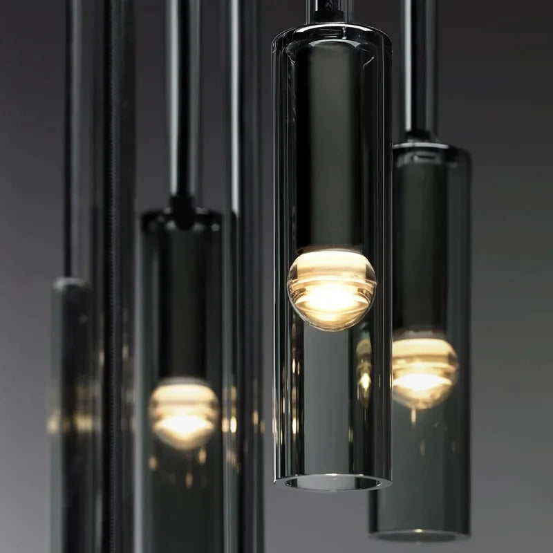 Lampa wisząca E27 z cylindrycznym kloszem ze szkła dymionego. Nowoczesne oświetlenie wnętrz, minimalistyczny design.