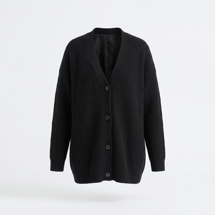 Kobieta w modnym blezerze oversize, prezentująca luźny krój i elegancki styl casual. Odzież wierzchnia.