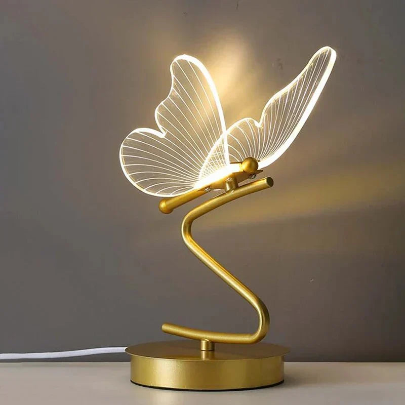 Nowoczesna lampa stołowa z delikatnym motylem. Ciepłe światło LED, idealne do stylowych wnętrz.