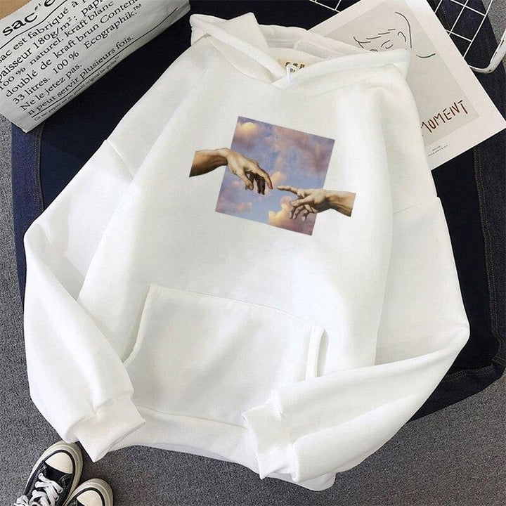 Wygodna damska bluza hoodie, z kapturem i artystycznym nadrukiem dłoni. Modny wybór na każdą okazję.