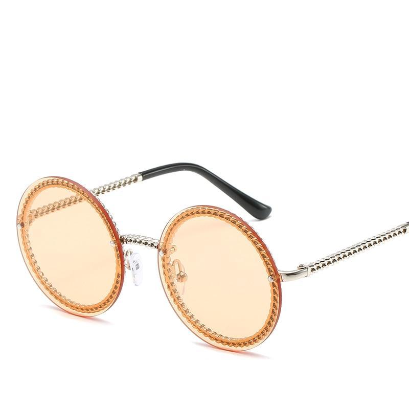 Eleganckie damskie okrągłe okulary przeciwsłoneczne. Stylowa ochrona UV, idealne akcesoria modowe.
