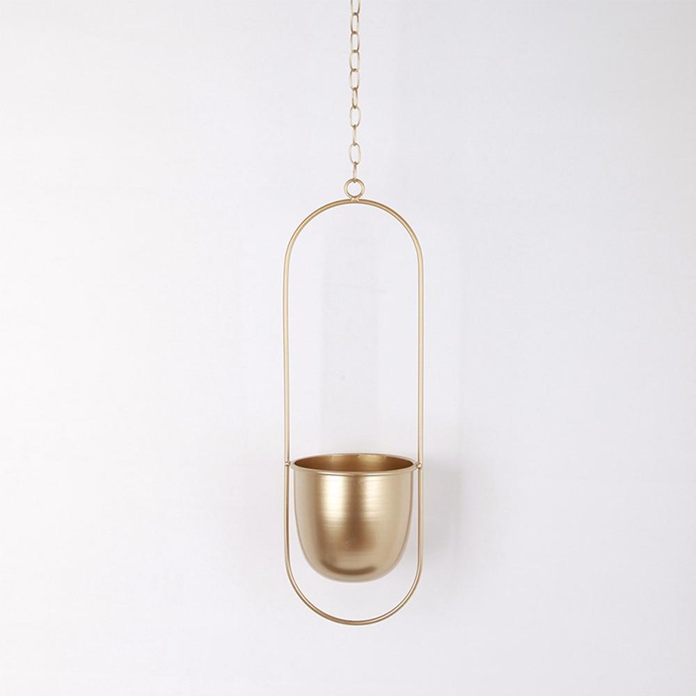 Nowoczesny wieszak na rośliny, dekoracja ścienna. Metalowy, minimalistyczny design do domu.