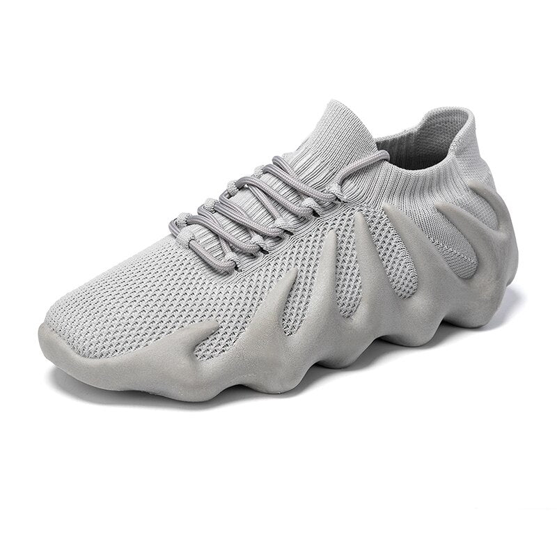 Uniwersalne sneakersy Milo: przewiewne buty sportowe idealne do biegania i aktywności fizycznej.