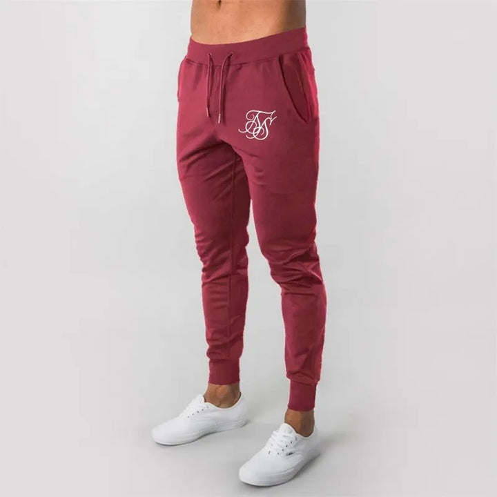 Męskie spodnie dresowe z modnym nadrukiem, idealne do codziennych stylizacji casualowych i sportowych.