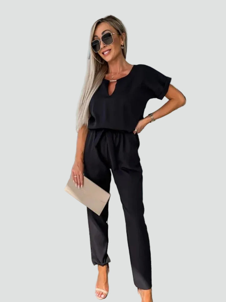 Damski kombinezon, elegancki, z krótkim rękawem, wiązaniem w talii, luźny krój, idealny na casual i wieczór.