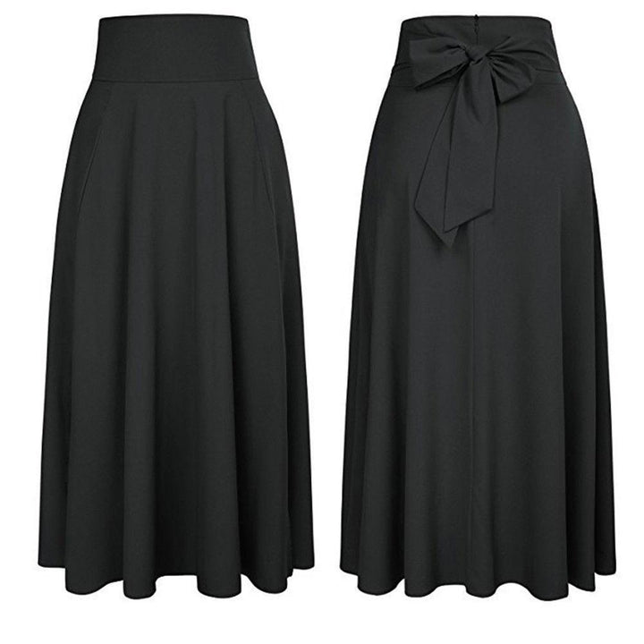 Stylowa damska spódnica maxi z kokardą i kieszeniami. Casualowa i elegancka, doskonała na lato, zapewnia komfort.