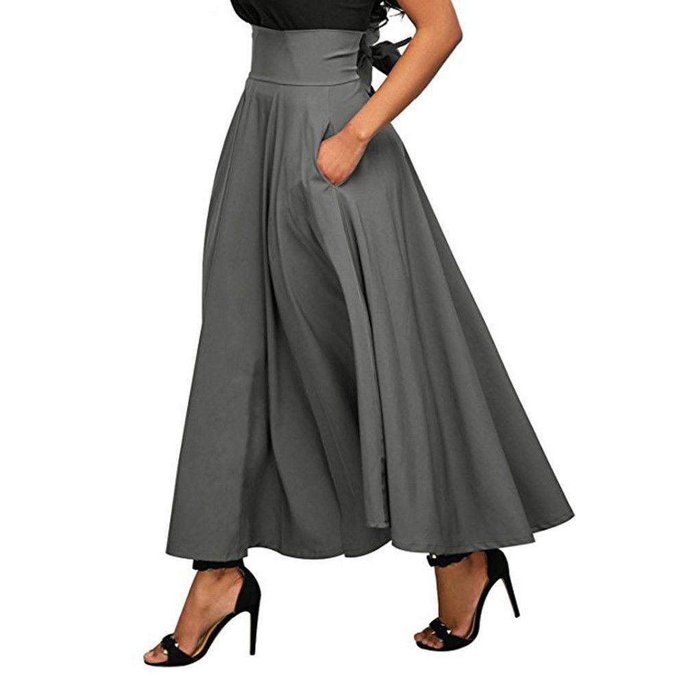 Elegancka damska spódnica maxi w modnym fasonie A, z kieszeniami. Komfortowa na lato, idealna do casualowych stylizacji.
