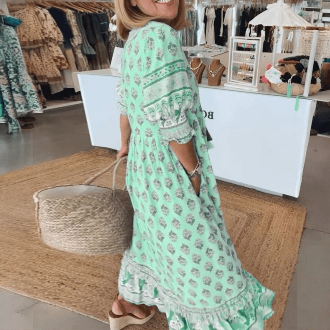 Wzorzysta sukienka midi boho damska z wiązaniem w pasie. Idealna na lato i wiosnę, styl casual.