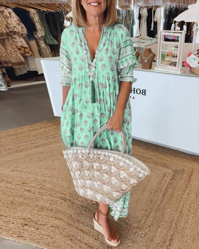 Modna wzorzysta sukienka midi boho z frędzlami i wiązaniem. Damska, casualowa, na co dzień.