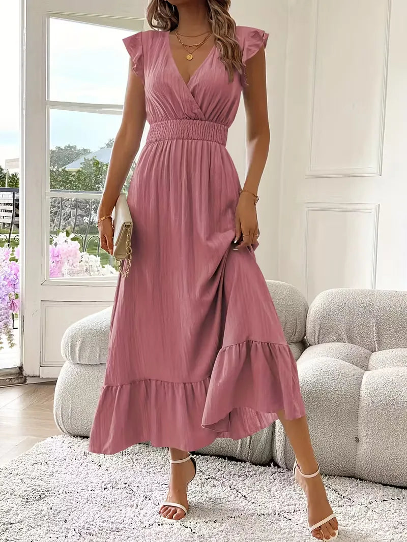 Modna damska sukienka maxi na wesele. Kopertowy dekolt, falbana. Elegancka, długa. Idealna na przyjęcie.