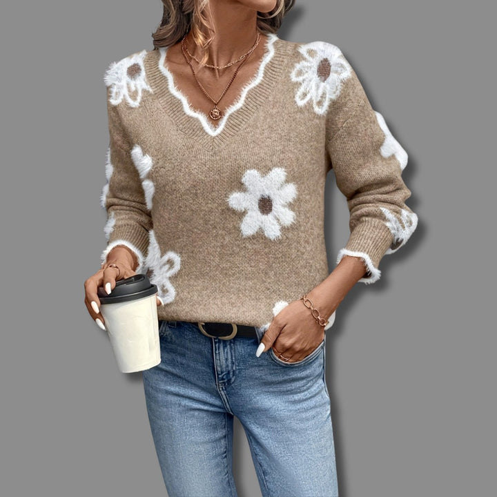 Jesienny sweter damski z dzianiny, dekolt V, luźny krój i elegancki kwiatowy wzór, idealny do stylizacji.